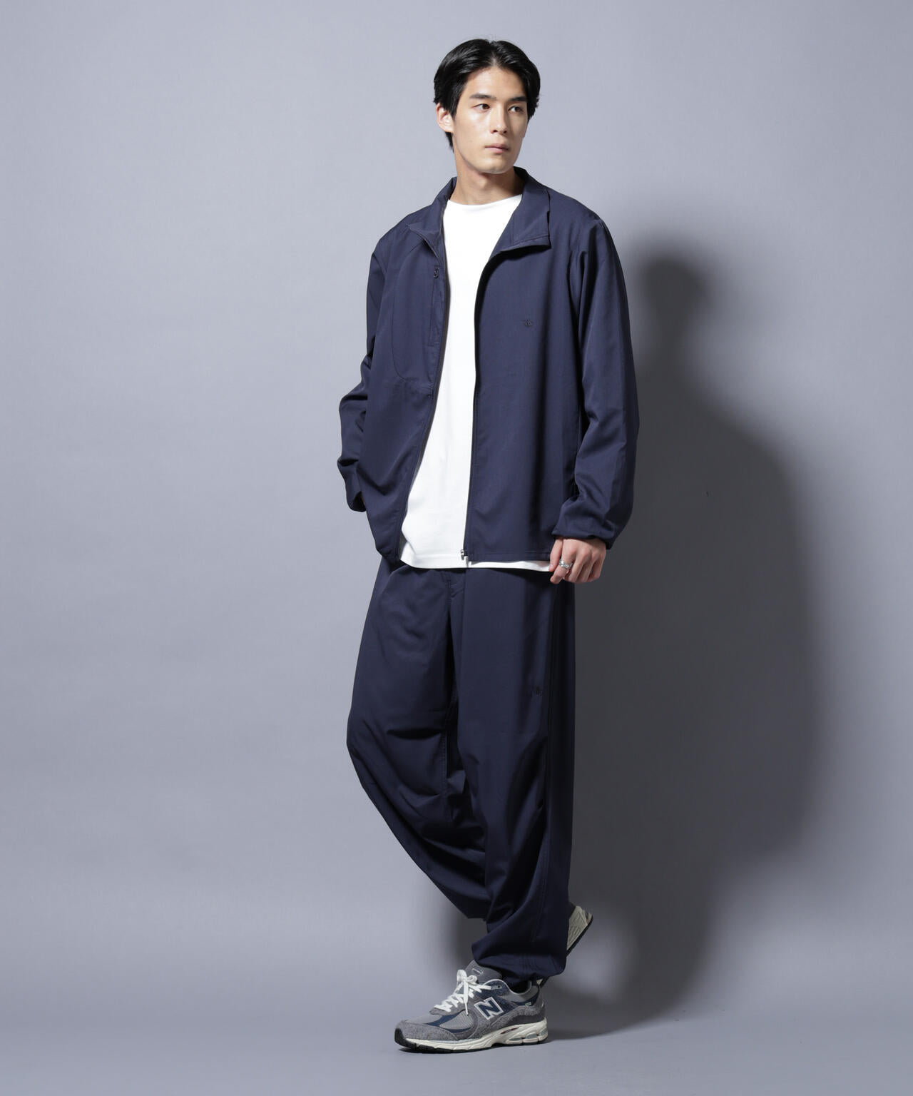 NJ/CLUB」ワンポイントロゴトラックパンツ